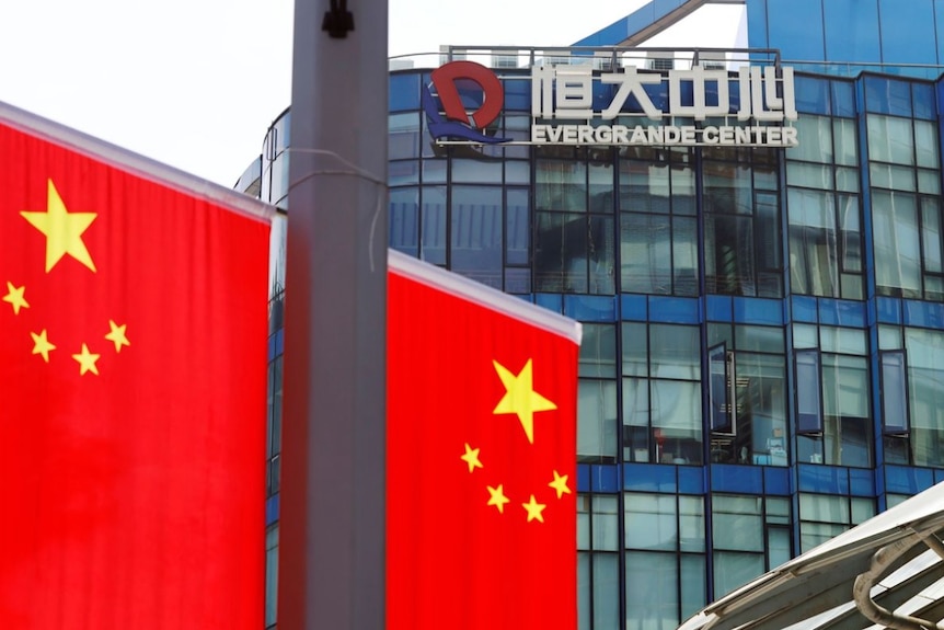 Chinese flags near the logo Evergrande Centre in Shanghai, China, on September 24, 2021.