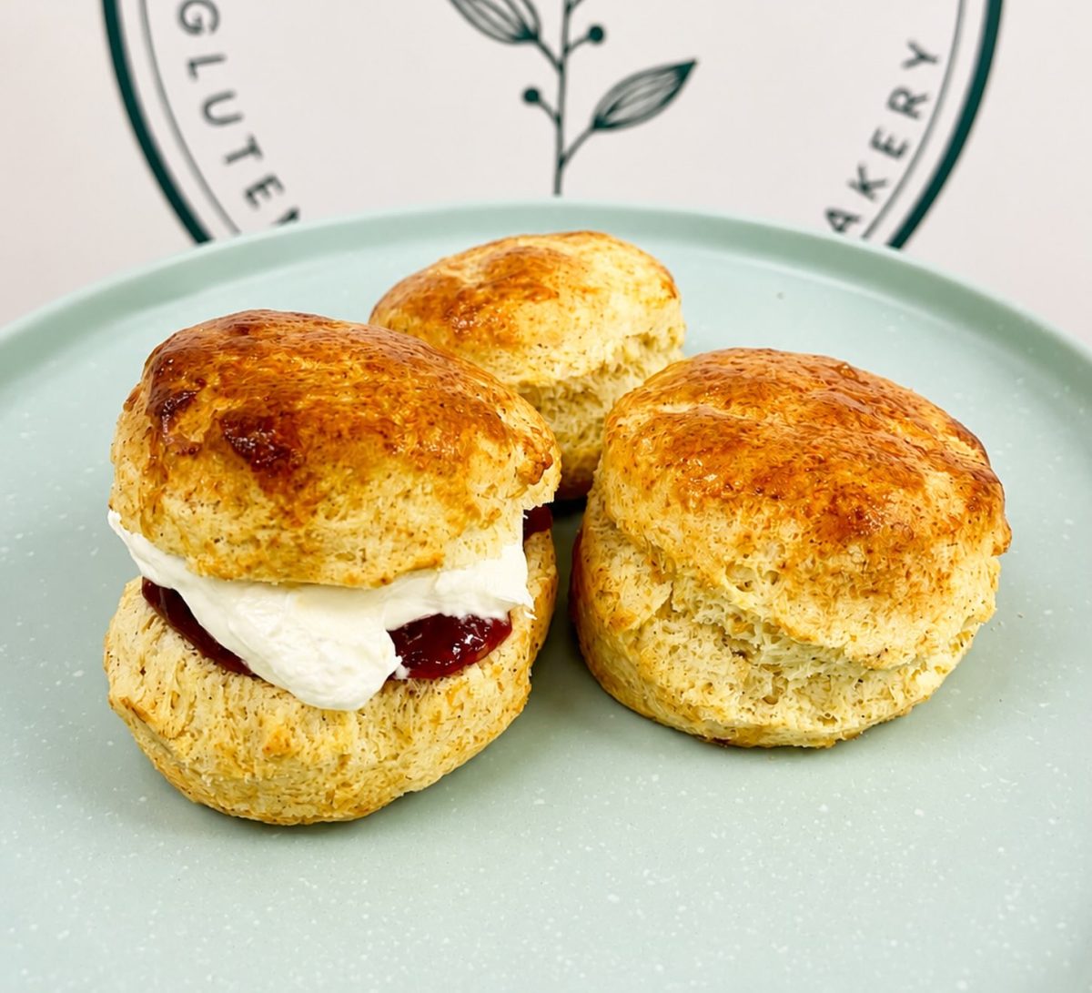 Three scones on a plate with the Freed.me logo behind.