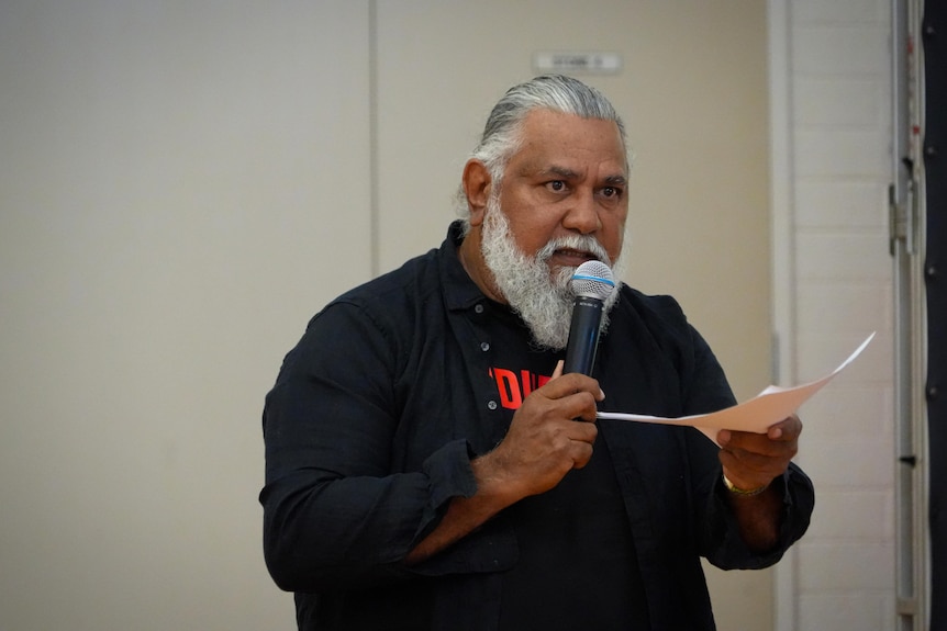 Michael Woodley speaks at the community meeting.