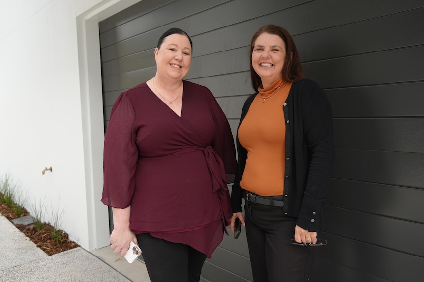 Two ladies outside door