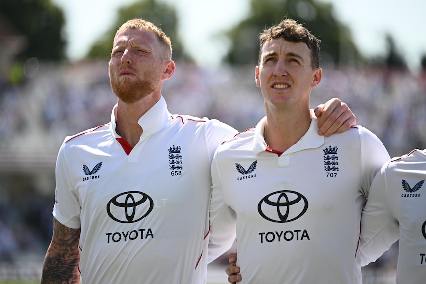 Ben Stokes with his arm around Harry Brook during the national anthem.