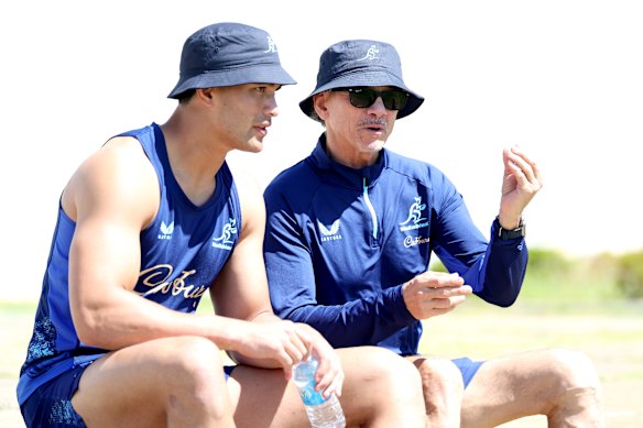 Joseph-Aukuso Suaalii and Les Kiss chat at training ahead of Saturday’s match against Japan.
