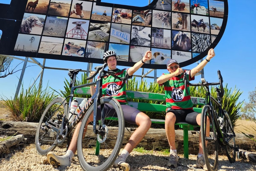Grandfather, grandson wear South Sydney Rabbitohs jerseys.