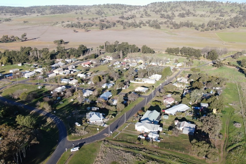 A drone shot of a small cluster of houses