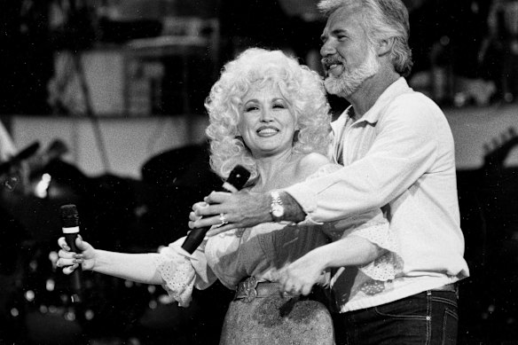 Dolly Parton and Kenny Rogers rehearse a song for their appearance on the TV show “Live... And in Person” in Los Angeles on September 27, 1983.