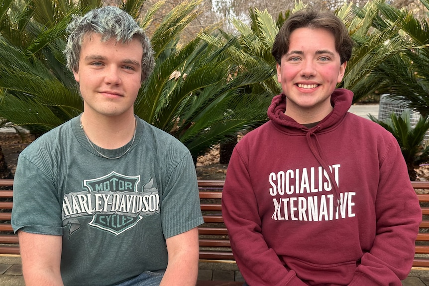 Two people on a bench.