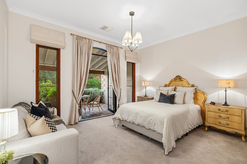 In the master suite, heads of the home are treated to a generous walk-in wardrobe and an ensuite with a corner bathtub.