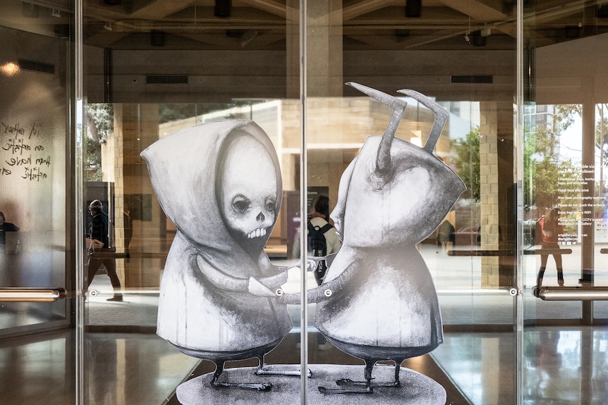 Abstract art showing images of young male figures at the doors of an art gallery