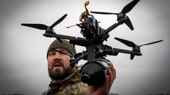 A Ukrainian soldier demonstrates a locally-made drone in the Kyiv region.