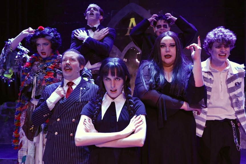 The cast of a production of the Adams Family.