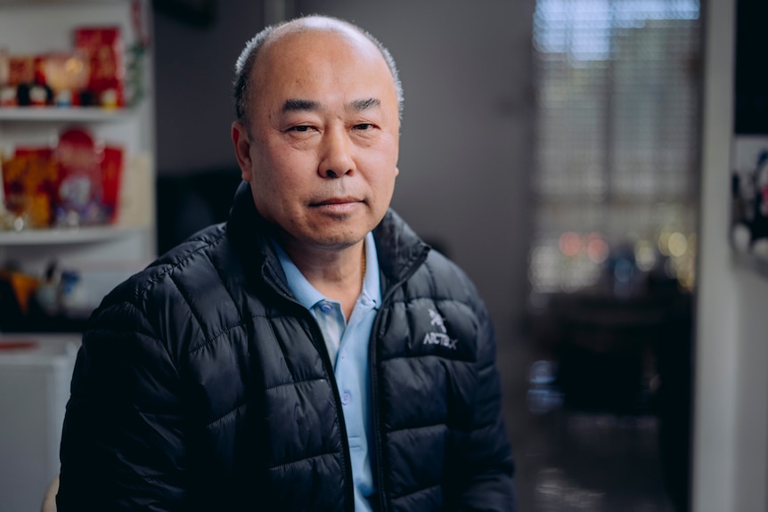 man in puffer jacket looking at camera