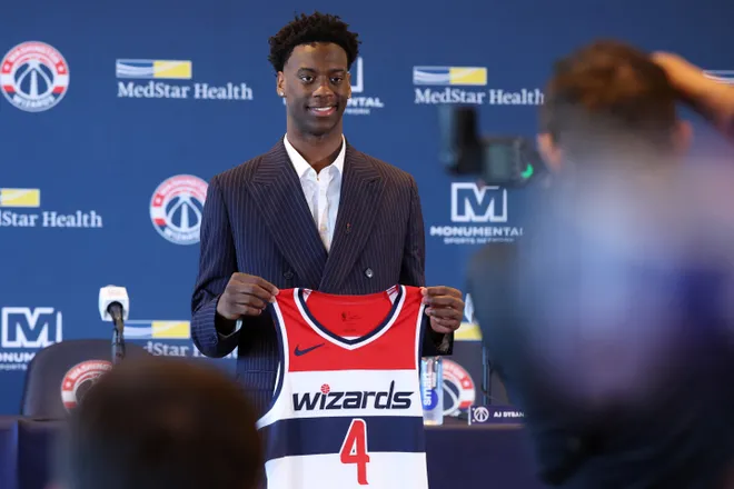 Jun 25, 2026; Washington, DC, USA; Washington Wizards first round draft pick and number one overall pick AJ Dybantsa poses for a photo with his jersey during a press conference at InterContinental Hotel. Mandatory Credit: Amber Searls-Imagn Images