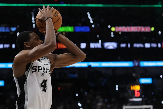 Jun 13, 2026; San Antonio, Texas, USA; San Antonio Spurs guard De'aaron Fox (4) shoots against the New York Knicks during game five of the 2026 NBA Finals at Frost Bank Center. Mandatory Credit: Geoff Burke-Imagn Images