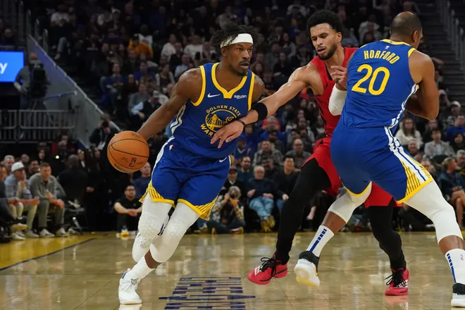 Jan 13, 2026; San Francisco, California, USA; Golden State Warriors forward Jimmy Butler III (10) dribbles upcourt against Portland Trail Blazers forward Toumani Camara (33) as Golden State Warriors center/forward Al Horford (20) sets a pick in the third quarter at Chase Center. Mandatory Credit: David Gonzales-Imagn Images