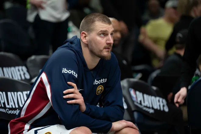 Apr 30, 2026; Minneapolis, Minnesota, USA; Denver Nuggets center Nikola Jokic (15) seats on the bench before the second half begins against the Minnesota Timberwolves during game six of the first round of the 2026 NBA Playoffs at Target Center. Mandatory Credit: Jesse Johnson-Imagn Images