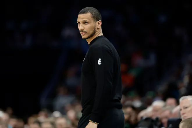 Mar 29, 2026; Charlotte, North Carolina, USA; Boston Celtics Head Coach Joe Mazzulla watches from the sideline during the first quarter against the Charlotte Hornets at Spectrum Center. Mandatory Credit: Brian Westerholt-Imagn Images