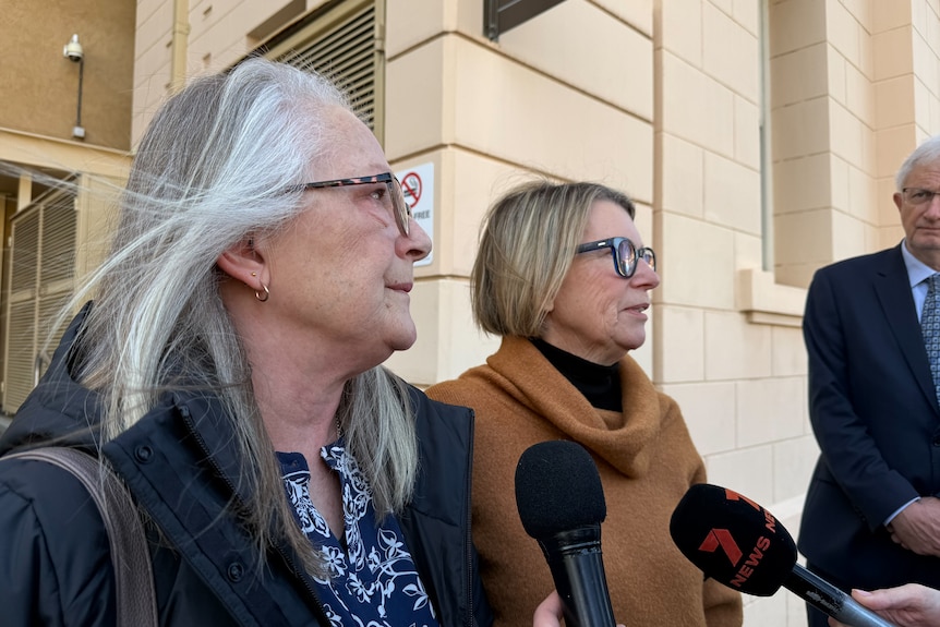 Two women outside the SA coroners court.