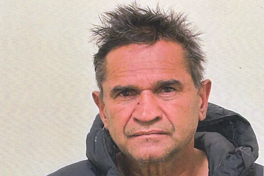 An arrest photo of Nicky Winmar