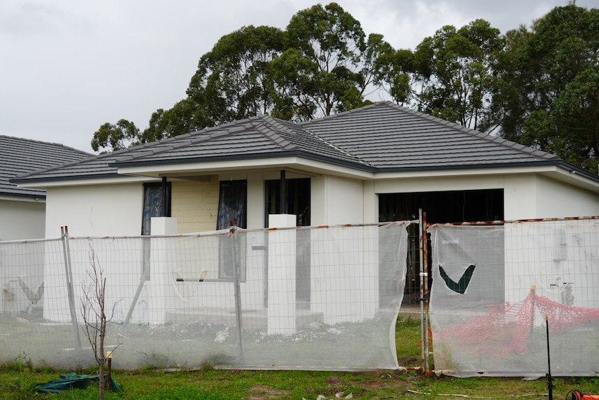 A home site where the house is looking like it is close to completion.