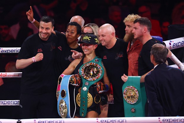 Cherneka Johnson celebrates becoming undisputed world champion.