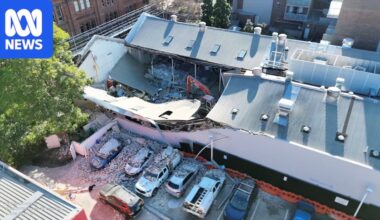 Two seriously injured in Sydney building collapse next to petrol station