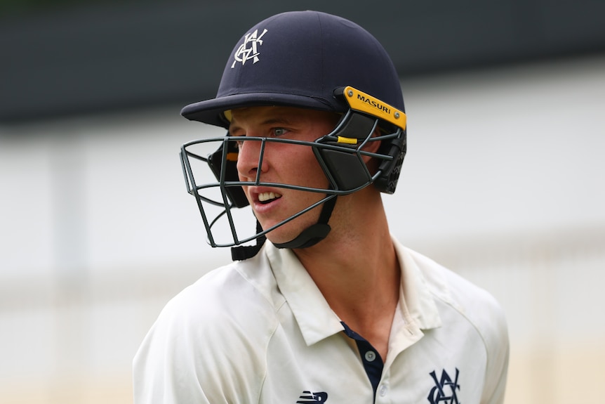 Campbell Kellaway looks out from under a batting helmet