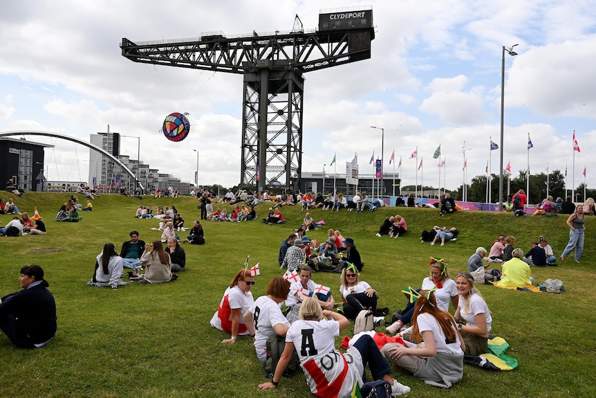 Fans gather near the Finnieston Crane at the 2026 Glasgow Commonwealth Games.