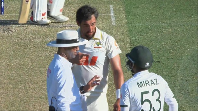 Mitchell Starc and Mehidy Hasan Miraz exchange words late on Day 2.