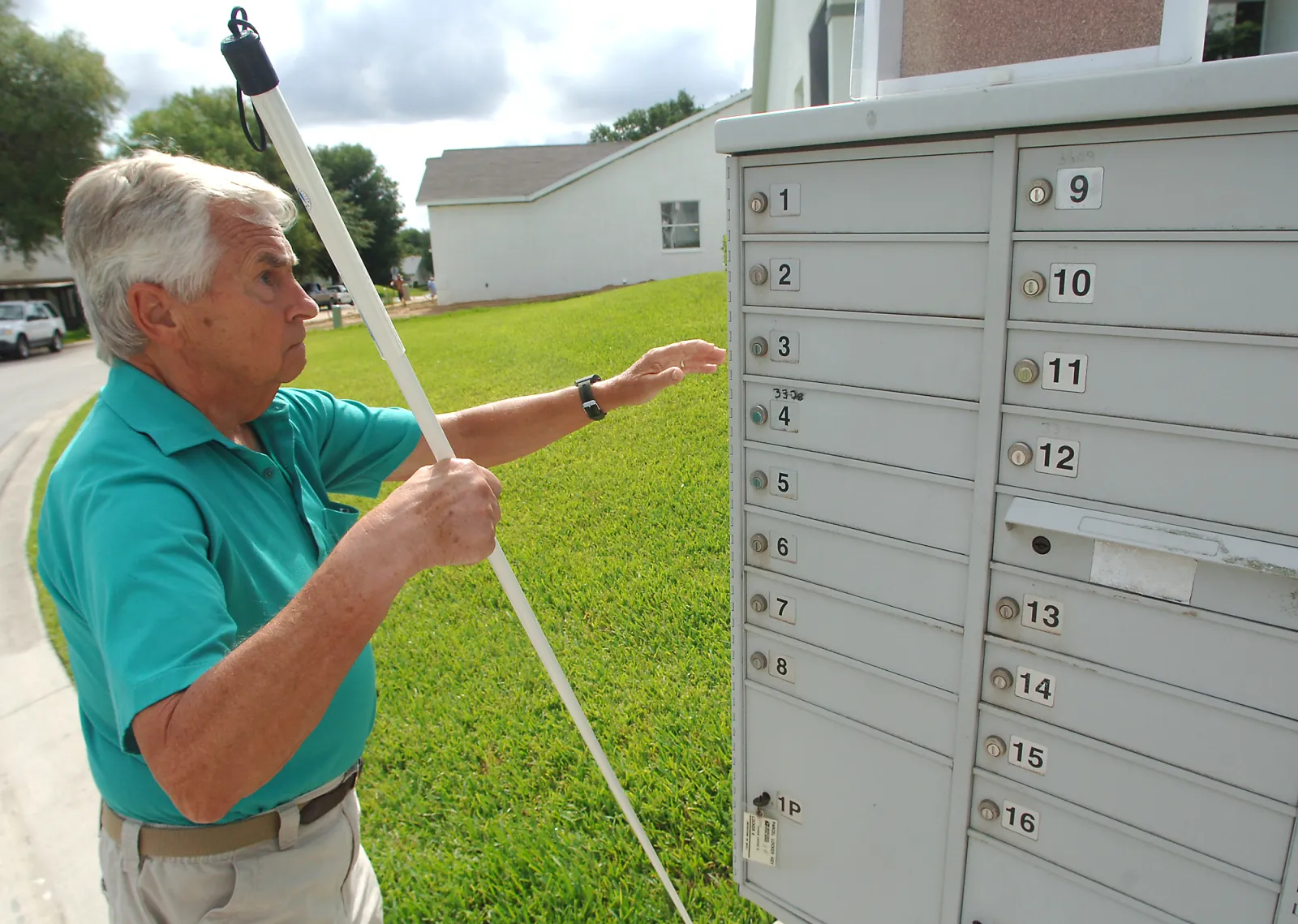 Butch Shultz of Inverness, Fla., prepares to check his mailbox in his Royal Oaks community June 17, 2006.  (AP Photo/Citrus County Chronicle, Matthew Beck)