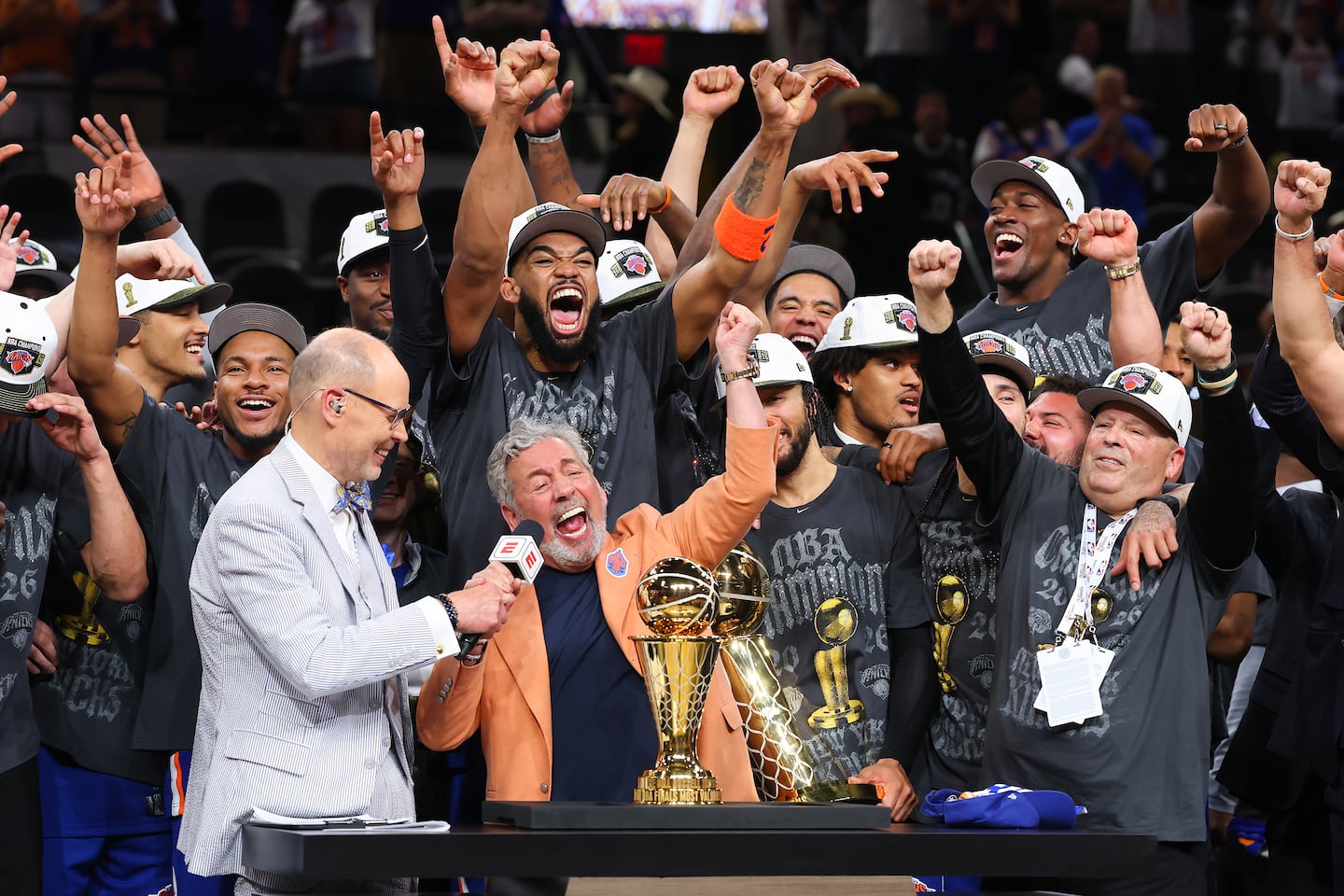 Knicks owner James Dolan (center) is far from the only one of his peers eager to limit his team's spending.