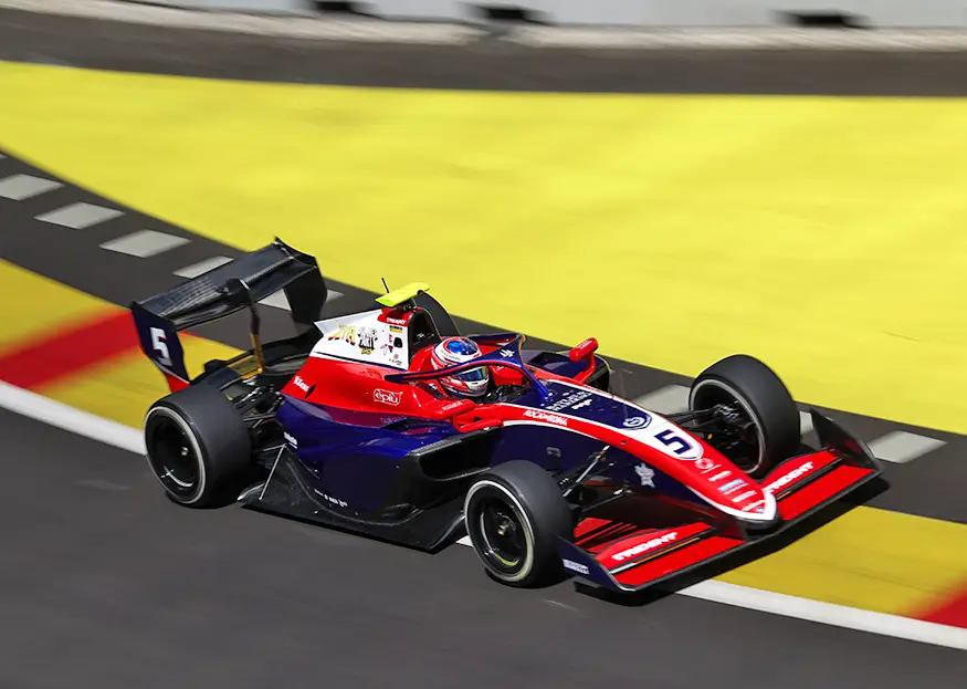 Freddie Slater's TRIDENT car through a kerbed corner at the Madring circuit in Madrid