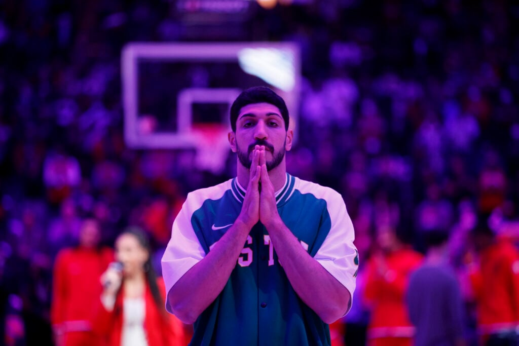 Enes Kanter #13 of the Boston Celtics during the American national anthem prior to the first half of their NBA game against the Toronto Raptors at Scotiabank Arena on November 28, 2021 in Toronto, Canada.
