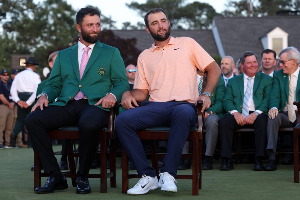 Jon Rahm of Spain (L) and Scottie Scheffler of the United States attend the Green Jacket Ceremony after Scheffler won the 2024 Masters Tournament