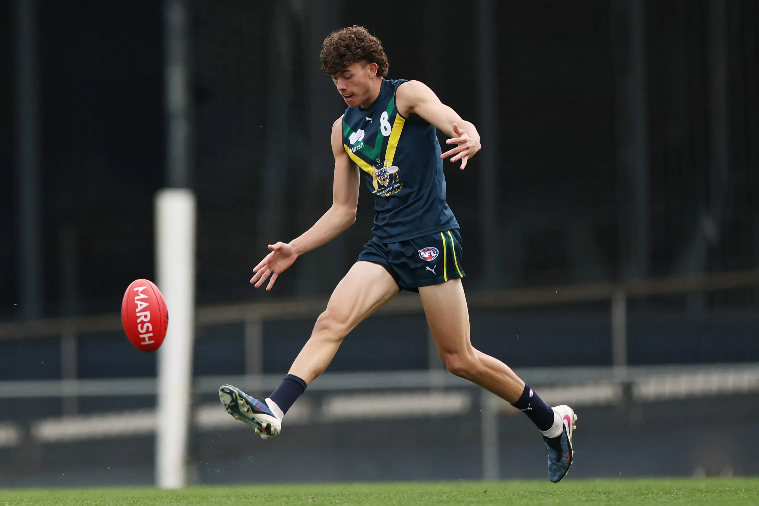 MELBOURNE, AUSTRALIA - APRIL 18: Harrison Chapman of the AFL National Academy kicks the ball during the Marsh AFL National Academy Boys match between Australia U18 and Richmond VFL at Ikon Park on April 18, 2026 in Melbourne, Australia. (Photo by Morgan Hancock/AFL Photos/via Getty Images)