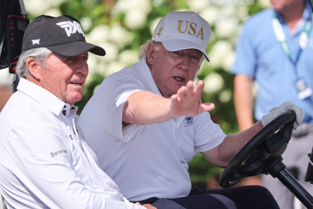 President Donald Trump drives in a golf cart with Gary Player at Bedminster before the forth round of LIV Golf New York on August 9, 2026 at Trump National Golf Club