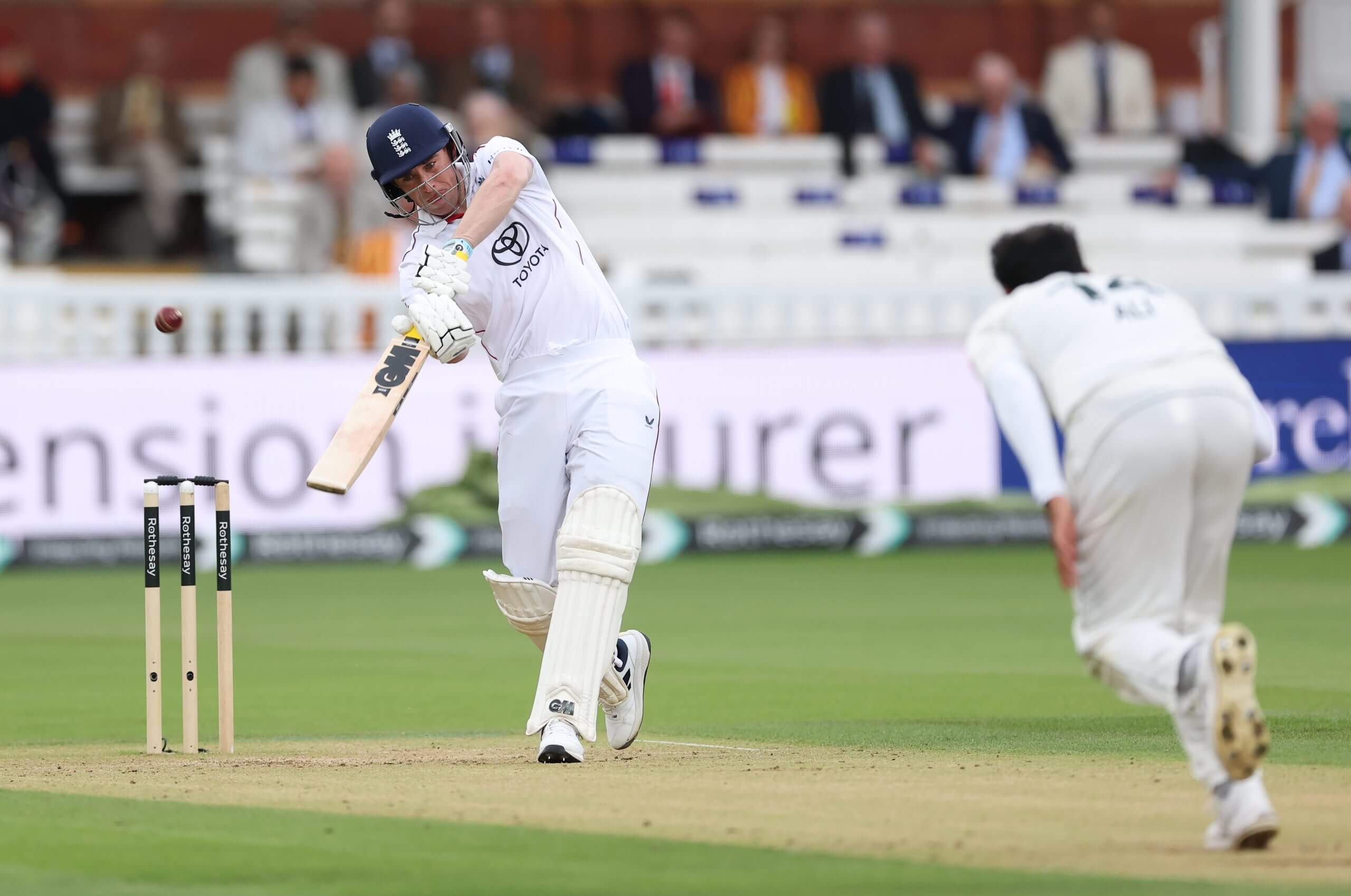 Dan Lawrence advances down the pitch and smashes Mohammad Ali for six over extra cover on day three