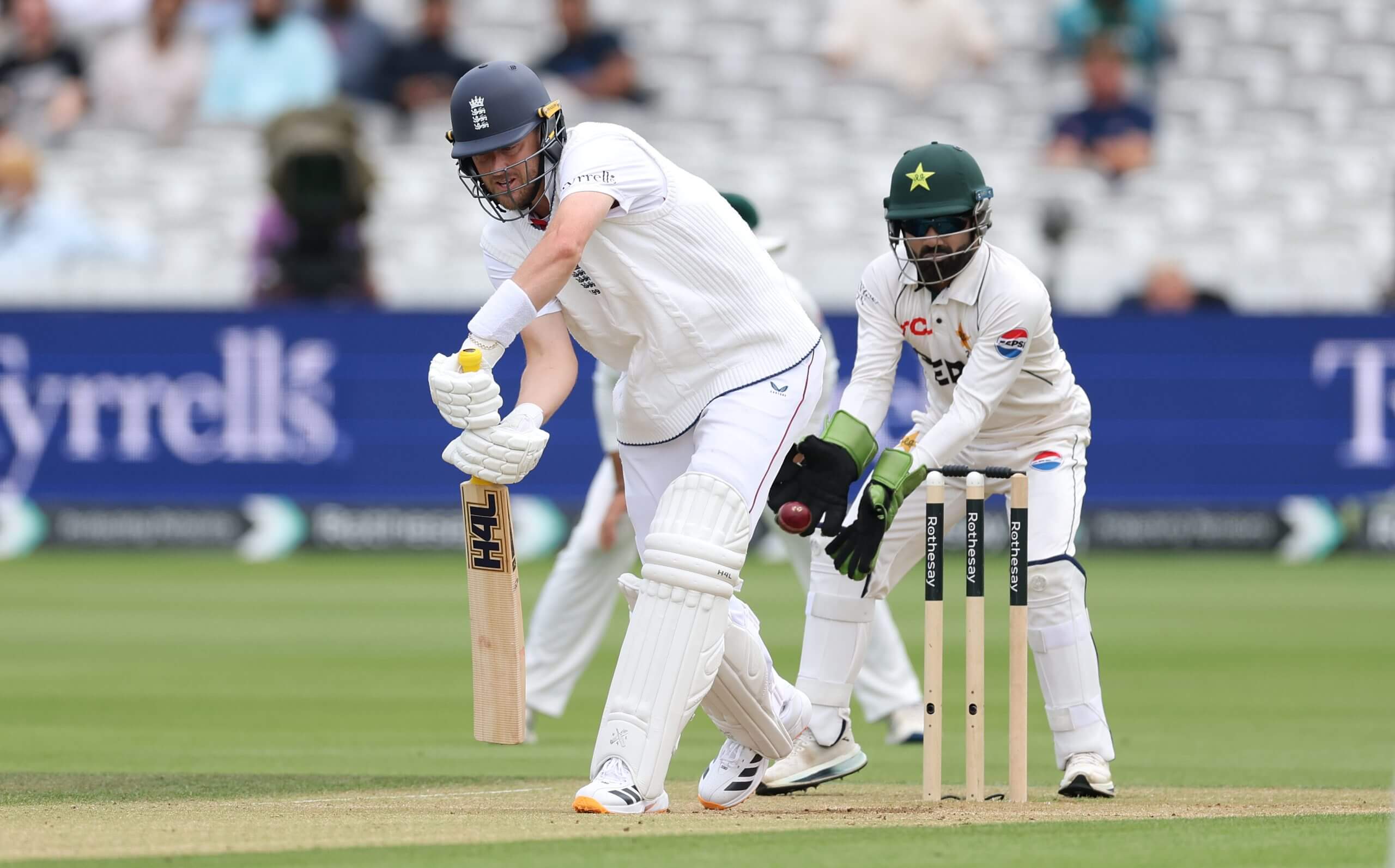 Mohammad Rizwan keeps his eye on the ball to catch Ollie Robinson