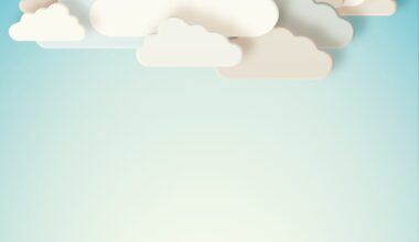white paper cut-out clouds on blue background