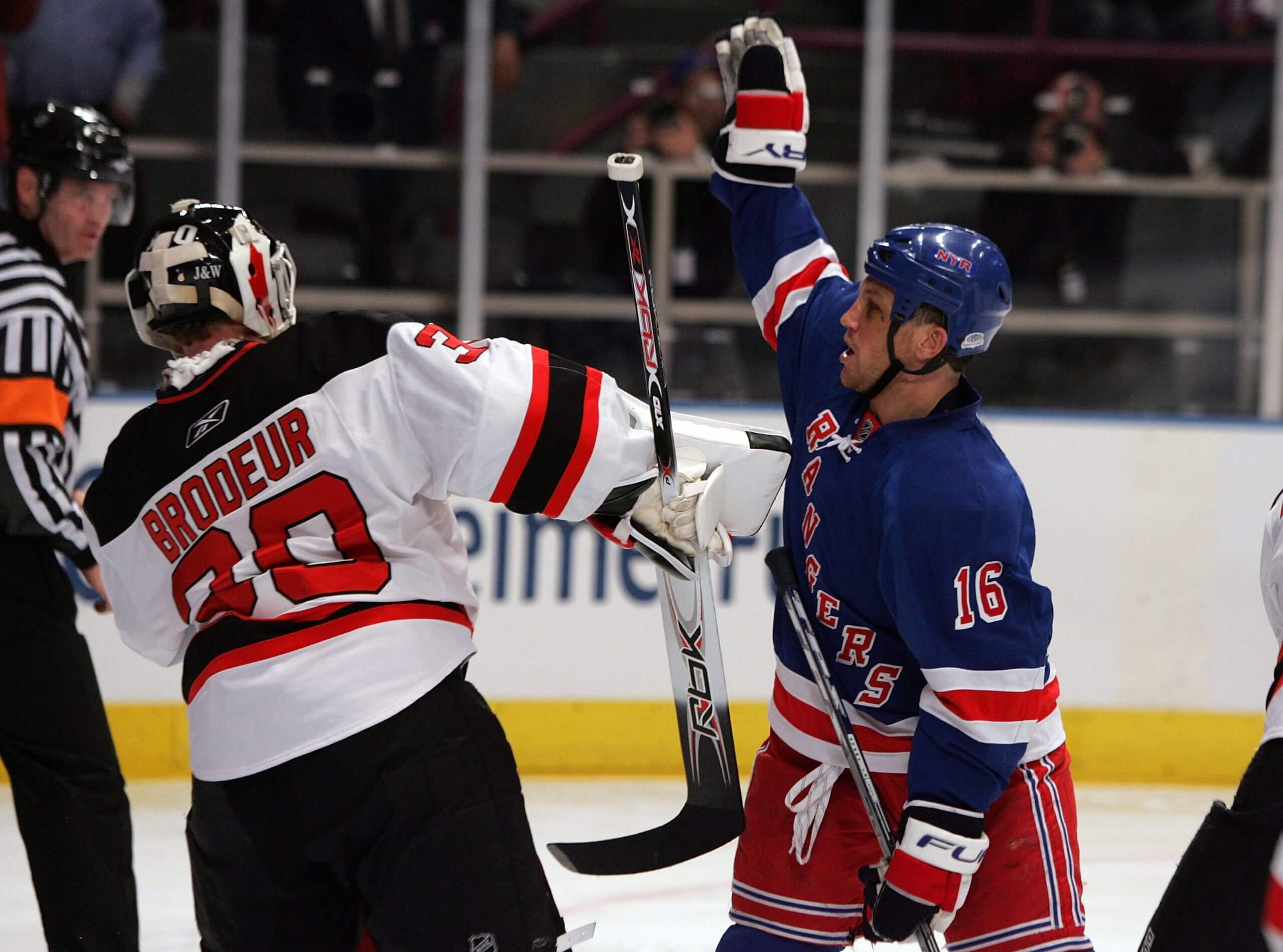 The Rangers' Sean Avery stands in front of Devils goalie Martin Brodeur and raises his hand in an effort to block Brodeur's vision during the 2008 playoffs.