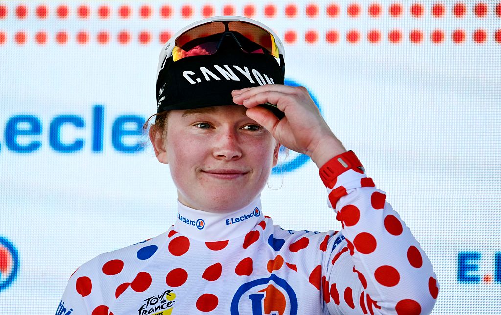 Fenix-Deceuninck's Dutch rider Puck Pieterse celebrates on the podium with the best climber's polka dot (dotted) jersey after the 5th (out of 9) stage of the fifth edition of the Women's Tour de France cycling race, 140 km from Macon to Belleville-en-Beaujolais, in Belleville-en-Beaujolais, central France on August 5, 2026. (Photo by NICOLAS TUCAT / AFP)