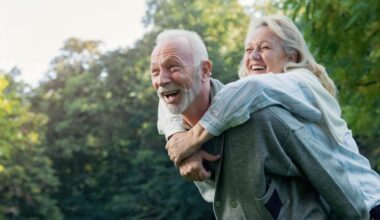 Happy Senior Couple Playing Outdoors Nature