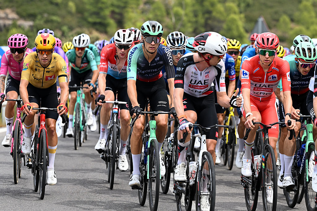 ARAMON VALDELINARES, SPAIN - AUGUST 29: (L-R) Tobias Halland Johannessen of Norway and Team Uno-X Mobility, Oscar Chamberlain of Australia and Team Decathlon CMA CGM and Tadej Pogacar of Slovenia and UAE Team Emirates XRG - Red Leader Jersey compete during the La Vuelta - 81st Tour of Spain 2026, Stage 7 a 149.48m stage from Vall d&amp;apos;Alba to Aramon Valdelinares 1965m / #UCIWT / on August 29, 2026 in Aramon Valdelinares, Spain. (Photo by Tim de Waele/Getty Images)