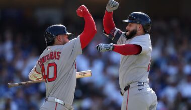 Willson Contreras (left) welcomes Wilyer Abreu, who hit a home run in the third inning at Dodger Stadium on Sunday.