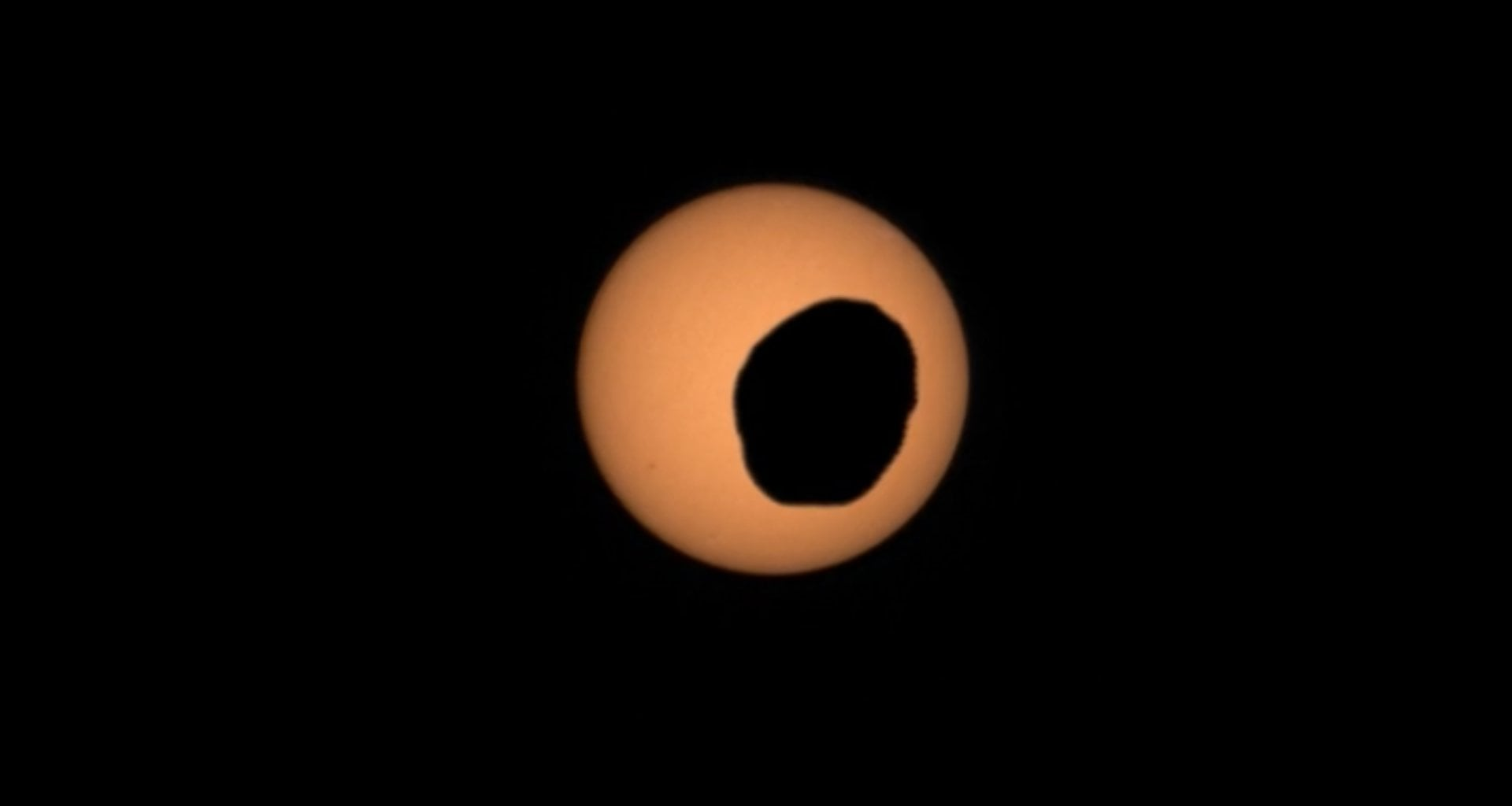 Perseverance sees Phobos cross in front of the Sun. Credit: NASA/JPL-Caltech/ASU/MSSS/SSI