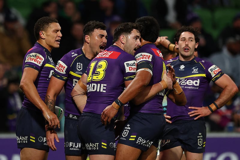 Will Warbrick of the Storm (L) and his teammates celebrate a try during the round 19 NRL match between Melbourne Storm and Gold Coast Titans