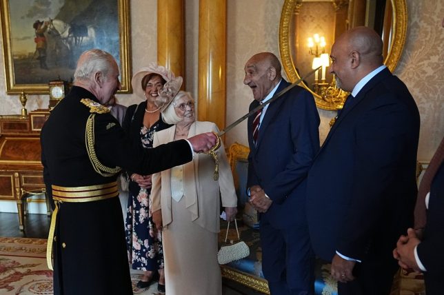 LONDON, ENGLAND - JUNE 10: Rugby league star Billy Boston being Knighted by King Charles III at Buckingham Palace on June 10, 2025 in London, England. (Photo by Aaron Chown - WPA Pool / Getty Images)