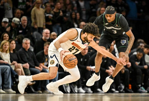 Jaden McDaniels (3) of the Minnesota Timberwolves defends Jamal Murray (27) of the Denver Nuggets during the first quarter of Game 6 of their NBA Playoffs series at the Target Center in Minneapolis, Minnesota on Thursday, April 30, 2026. (Photo by AAron Ontiveroz/The Denver Post)