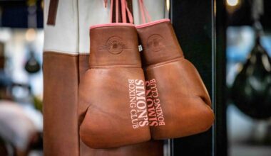 A pair of boxing gloves hang inside Simon s Boxing Club January 23, 2023. Simon "The Phoenix," Bakinde was born in Cameroon,