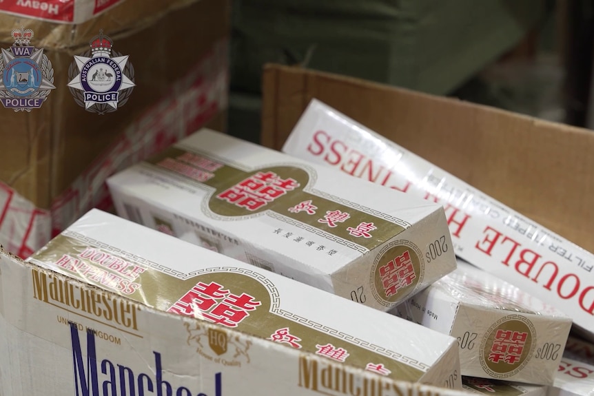 A carton of imported cigarettes sits in a warehouse.