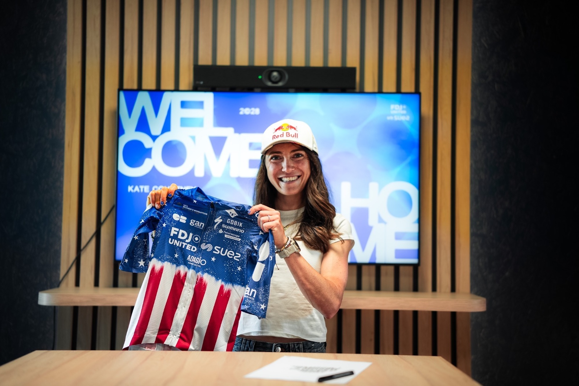 USPro road champion Kate Courtney holds her new FDJ United-SUEZ jersey after signing a short-term 2026 contract with the Women's WorldTour team